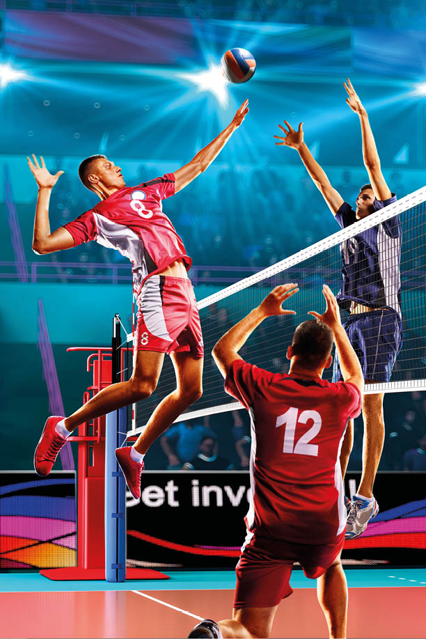 Professional volleyball players in action on the colour grand court