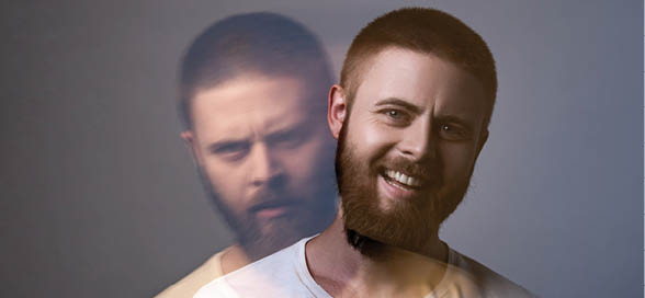Portrait of two-faced man in calm serious and happy expression. Different emotion inside and outside mood. Internally suffering, dissociative identity disorder. Double exposure. indoor, studio shot