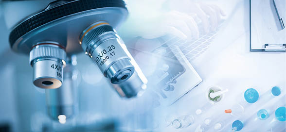 Panoramic web banner of microscope in a medical research lab or science laboratory.